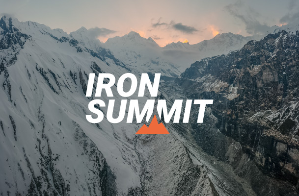 Mountains in dramatic evening mood and Iron Summit logo